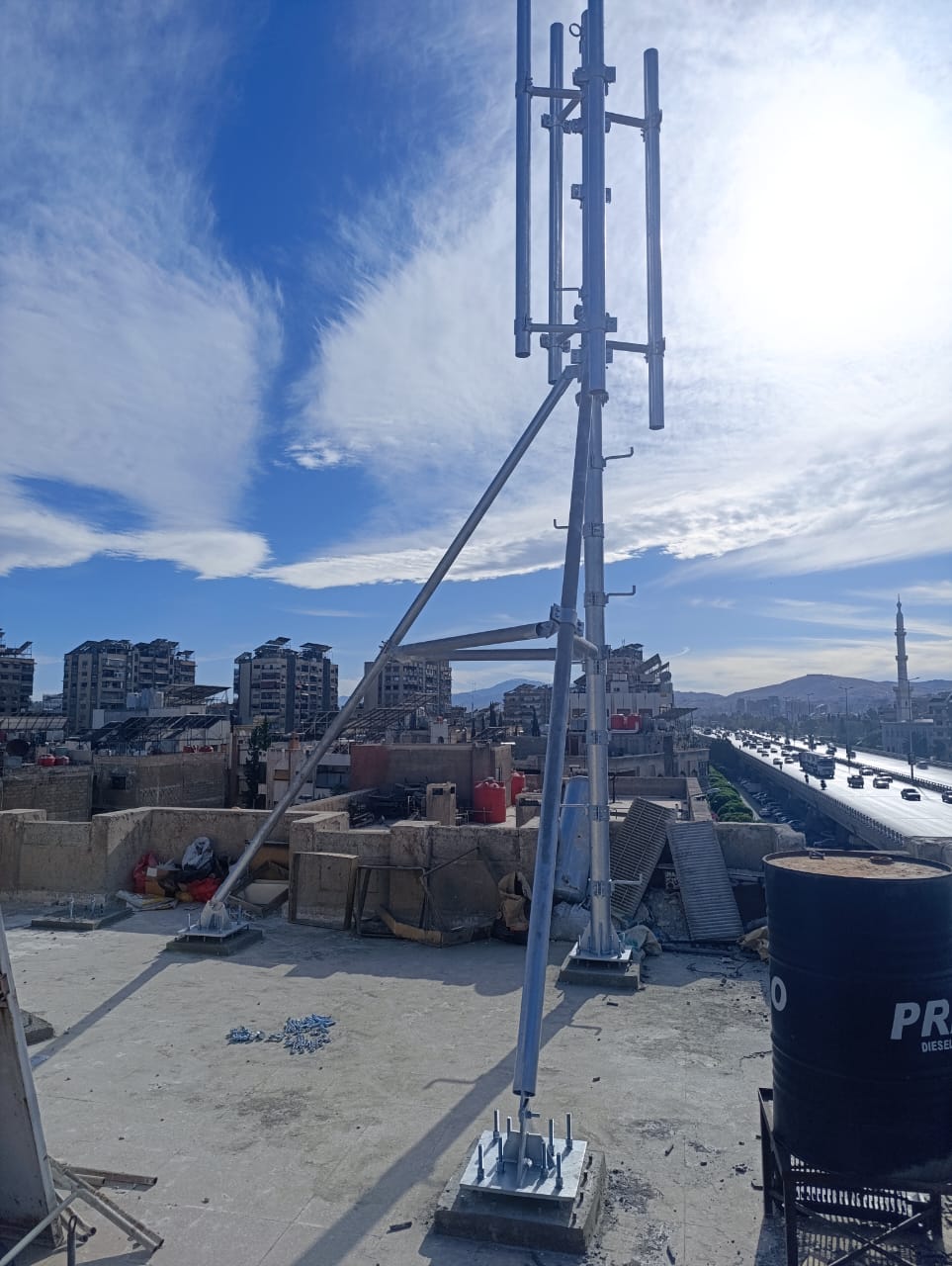 Rooftop mast over the Damascus skyline